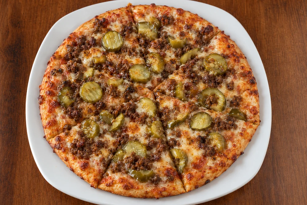 Pickle pizza with seasoned beef, mozzarella, and sliced pickles